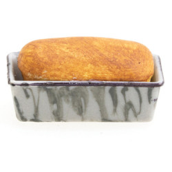 LOAF OF BREAD IN GRAY GRANITEWARE PAN