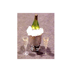 CHAMPAGNE BOTTLE IN ICE BUCKET W/2 FILLED GLASSES